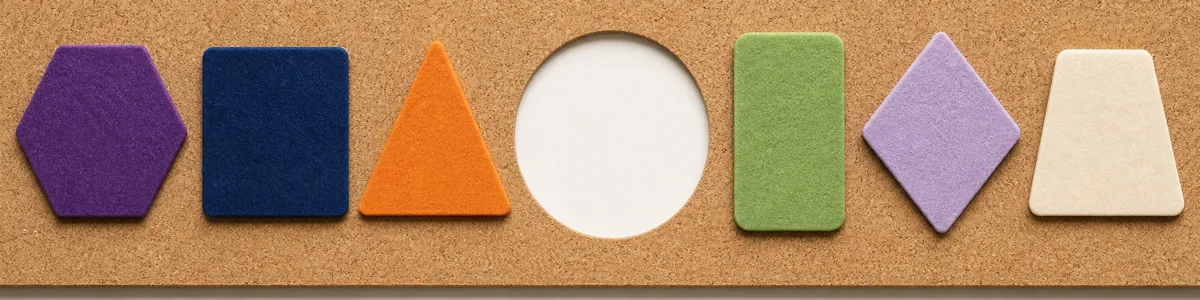 Six colorful felt shapes arranged around an empty circle on a cork display for adolescent group choice-making