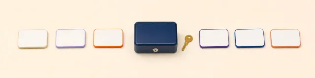 Six blank access badges, a closed navy lockbox, and one brass key representing controlled group-practice access
