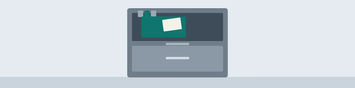 Cool slate filing cabinet with an open drawer, one teal hanging folder, and a blank card