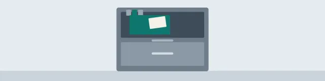 Cool slate filing cabinet with an open drawer, one teal hanging folder, and a blank card
