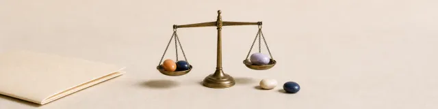 Brass balance with five ceramic stones and a closed clinical folder, representing clinician judgment across multiple risk factors